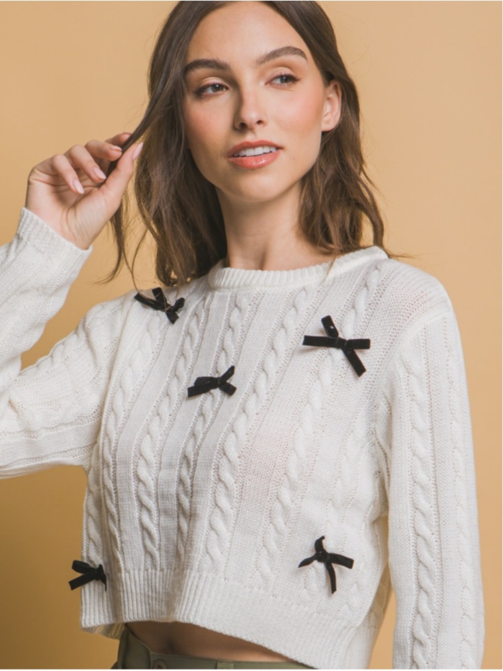 Cream Cable-Knit Crop Sweater with Black Bow Details